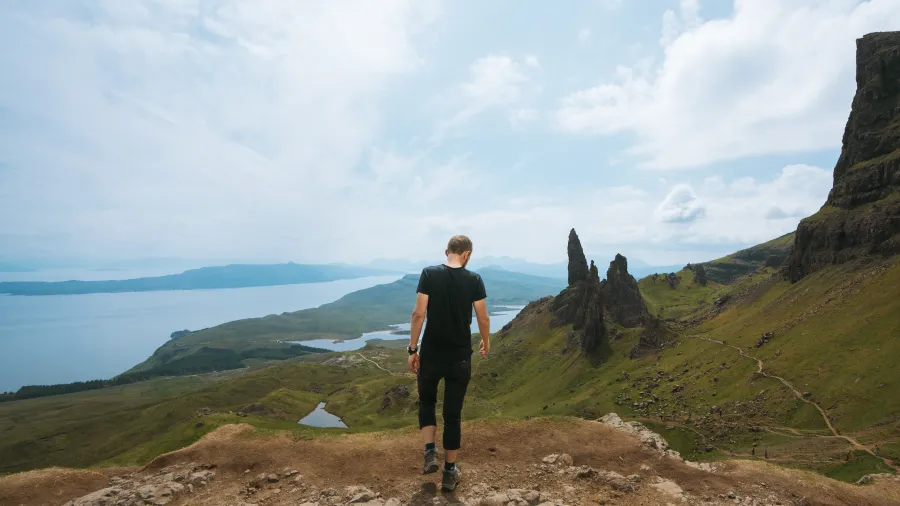man overlooking beautiful scotland highlands 